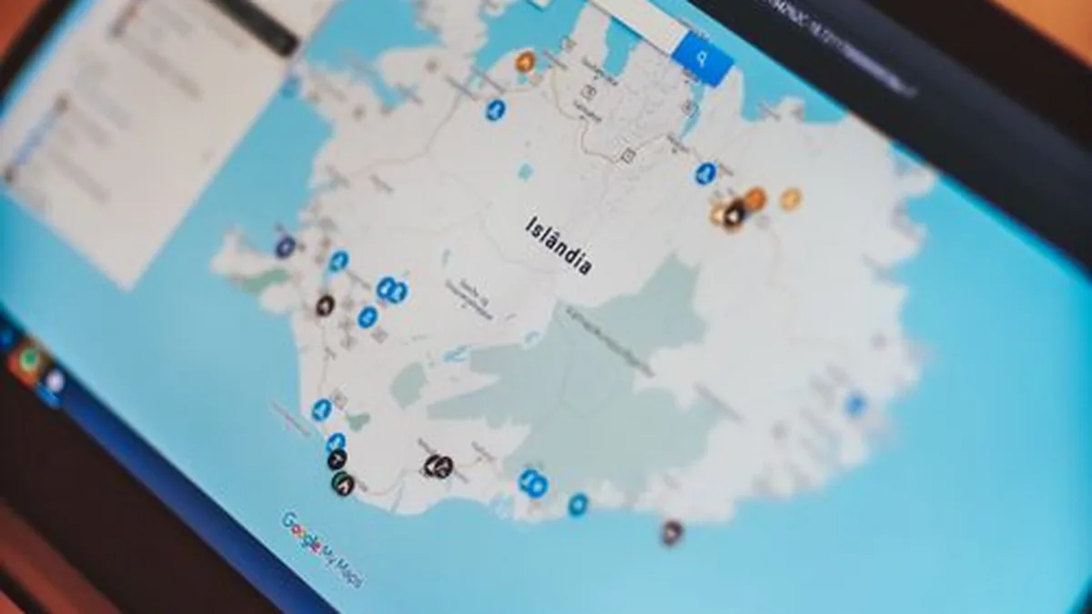 Laptop showing Google Maps with places and a search panel