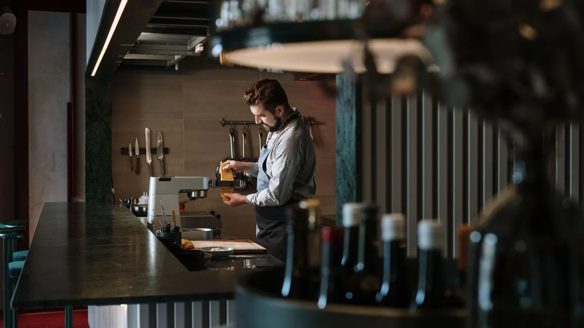 Chef preparing fresh pasta in a restaurant kitchen